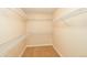 Walk-in closet featuring shelving with ample storage in neutral tones at 3390 Cranston Cir, Highlands Ranch, CO 80126