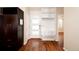 Inviting entryway with wood floors, modern storage, and a stylish front door at 3390 Cranston Cir, Highlands Ranch, CO 80126