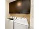 Laundry room featuring new appliances and dark wood cabinetry at 3390 Cranston Cir, Highlands Ranch, CO 80126