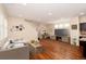 Comfortable living room area with wood floors, great natural light, and space for entertaining at 3390 Cranston Cir, Highlands Ranch, CO 80126