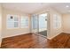 Open living area with hardwood floors, sliding glass doors, and ample natural light at 3390 Cranston Cir, Highlands Ranch, CO 80126