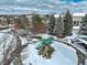 Winter aerial view of a park with play equipment and surrounding homes in a neighborhood at 4053 S Riviera St, Aurora, CO 80018