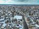 Panoramic aerial view of a snow-dusted residential area with tree-lined streets under a cloudy sky at 4053 S Riviera St, Aurora, CO 80018