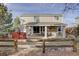 Fenced backyard featuring a patio, deck, and mature landscaping at 4053 S Riviera St, Aurora, CO 80018