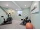 Basement exercise room featuring cardio and weight training equipment at 4053 S Riviera St, Aurora, CO 80018