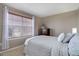 Comfortable bedroom with a large window and a dresser at 4053 S Riviera St, Aurora, CO 80018