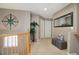 Bright upstairs hallway with neutral tones and natural light at 4053 S Riviera St, Aurora, CO 80018