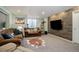 Cozy living room features a faux wood accent wall and comfortable seating arrangement at 4053 S Riviera St, Aurora, CO 80018