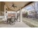 Covered patio with an outdoor dining set and ceiling fan at 4053 S Riviera St, Aurora, CO 80018