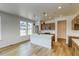 Bright, modern kitchen boasts a center island, pendant lighting, and stainless steel appliances at 23909 E 41St Ave, Aurora, CO 80019