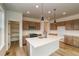 Modern kitchen features a large island, stainless steel appliances, and plenty of cabinet space at 23909 E 41St Ave, Aurora, CO 80019