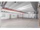 Unfinished basement with concrete floor, beams, and utilities at 10266 Stagecoach Ave, Firestone, CO 80504