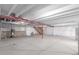Unfinished basement featuring concrete flooring and painted ceiling beams, ready for customization at 10266 Stagecoach Ave, Firestone, CO 80504