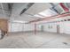 Expansive unfinished basement with white plastic sheeting, offering potential for flexible design at 10266 Stagecoach Ave, Firestone, CO 80504