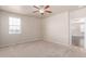 Bright bedroom featuring a window and access to the rest of the house at 10266 Stagecoach Ave, Firestone, CO 80504