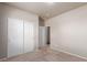 Bedroom with carpet floors, sliding closet doors and adjacent entryway at 10266 Stagecoach Ave, Firestone, CO 80504
