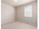 Bright bedroom with carpet flooring and a window with blinds at 10266 Stagecoach Ave, Firestone, CO 80504