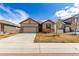 Charming ranch-style home with a two-car garage and nicely xeriscaped front yard at 10266 Stagecoach Ave, Firestone, CO 80504