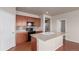 Charming kitchen with a spacious island and stainless steel appliances and tiled backsplash at 10266 Stagecoach Ave, Firestone, CO 80504