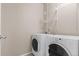 Laundry area with side-by-side washer and dryer at 10266 Stagecoach Ave, Firestone, CO 80504