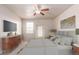 Comfortable primary bedroom featuring a ceiling fan and lots of space at 10266 Stagecoach Ave, Firestone, CO 80504