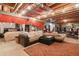 Spacious finished basement with ample seating, wood ceiling, and exposed ductwork at 3023 S Fenton St, Denver, CO 80227