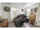 Comfortable bedroom with a cozy chair and built-in desk area at 3023 S Fenton St, Denver, CO 80227