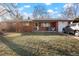 Charming single-story brick home with a well-maintained lawn and inviting front porch at 3023 S Fenton St, Denver, CO 80227