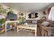 Cozy living room with plush sectional sofa and an eclectic collection of houseplants at 3023 S Fenton St, Denver, CO 80227