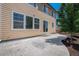 Backyard with concrete patio and mature trees offering privacy and shade at 6370 Twilight Ave, Firestone, CO 80504