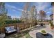 Beautifully landscaped backyard with a comfortable seating area and a dining table at 6370 Twilight Ave, Firestone, CO 80504