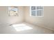 Bright bedroom with neutral carpet and plenty of natural light streaming through large windows at 6370 Twilight Ave, Firestone, CO 80504
