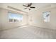 Spacious bedroom with carpet, a ceiling fan, and bright windows offering scenic views at 6370 Twilight Ave, Firestone, CO 80504