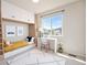 Well-lit bedroom featuring a built-in bed, desk, and ample storage space at 6370 Twilight Ave, Firestone, CO 80504