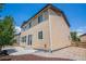 Rear exterior showing concrete patio, trees and well-maintained siding at 6370 Twilight Ave, Firestone, CO 80504