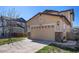 Spacious two-car garage with a well-maintained driveway and attractive exterior lighting at 6370 Twilight Ave, Firestone, CO 80504