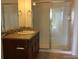 Bathroom featuring decorative vanity, granite countertop, and a stand up shower with sliding door at 804 Summer Hawk Dr # 6105, Longmont, CO 80504