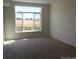 Neutral bedroom with great natural light and large window overlooking outdoor view at 804 Summer Hawk Dr # 6105, Longmont, CO 80504
