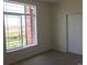 Bedroom featuring natural light and large window overlooking an outdoor view and double door closet at 804 Summer Hawk Dr # 6105, Longmont, CO 80504