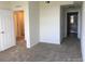 Bedroom with neutral carpet and a view to the bathroom. Features two closets for storage at 804 Summer Hawk Dr # 6105, Longmont, CO 80504