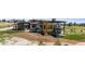Modern home with stone and wood facade, spiral staircase, balcony, and landscaped yard at 11115 Evening Hunt Rd, Franktown, CO 80116