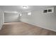 Spacious finished basement with laminate floors and natural light at 1765 S Endicott St, Lakewood, CO 80232