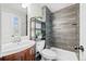 Contemporary bathroom boasting a sleek vanity, walk-in shower with modern fixtures, and updated finishes at 1765 S Endicott St, Lakewood, CO 80232