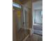 Bathroom with shower, built-in seat and double sinks at 498 Grey Rock St, Brighton, CO 80601
