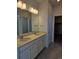 Modern bathroom with double vanity and walk-in shower at 498 Grey Rock St, Brighton, CO 80601