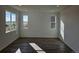 Bright and airy living room with hardwood floors and large windows at 498 Grey Rock St, Brighton, CO 80601