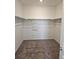 Large walk-in closet with neutral carpeting and double hanging rods at 498 Grey Rock St, Brighton, CO 80601