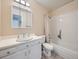 Bathroom featuring vanity with white cabinet, a combined shower and tub at 2446 S Vaughn Way # A, Aurora, CO 80014