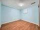 Cozy bedroom with a blue painted walls and hardwood floors at 2446 S Vaughn Way # A, Aurora, CO 80014