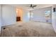 Expansive main bedroom with plush carpeting and two windows at 2446 S Vaughn Way # A, Aurora, CO 80014